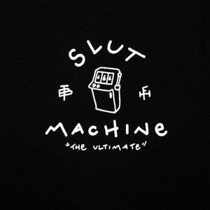 Close up of a slot machine and a white text which says "slut machine" and "the ultimate" screen-printed on the left chest of a black t-shirt