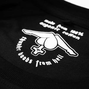 Close up of the white neck printing saying "made from 100% organic cotton and thunder boobs from hell" screen-printed on a black shirt